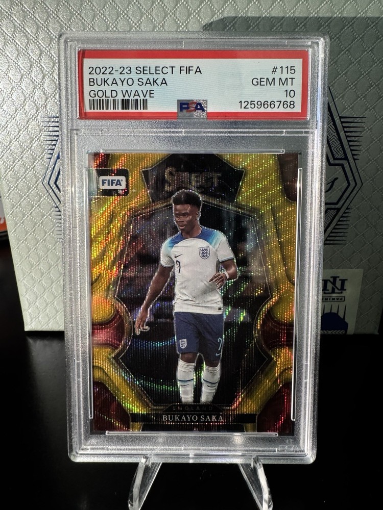 Bukayo Saka 2022-23 Panini Select FIFA Gold Wave 01/10 First Print PSA 10