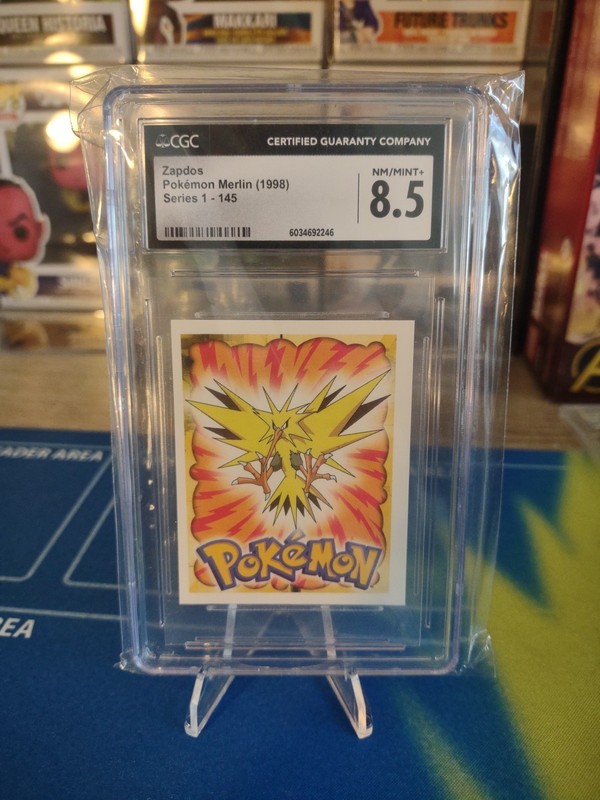 POKEMON SERIES 1, MERLIN TOPPS STICKER # 145, ZAPDOS, YEAR 1998 CGC 8.5
