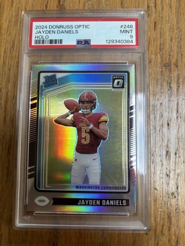 JAYDEN DANIELS 2024 Panini Donruss Optic - Rated Rookie  Holo Prizm (RC) PSA 9