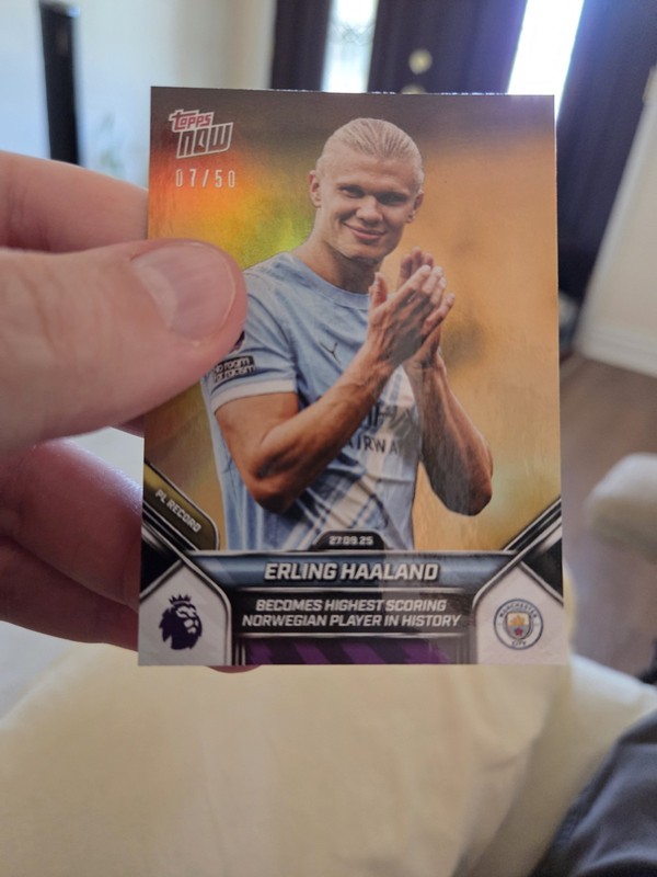 2025 Topps NOW Erling Haaland card 027 Gold Foil Numbered 07/50.