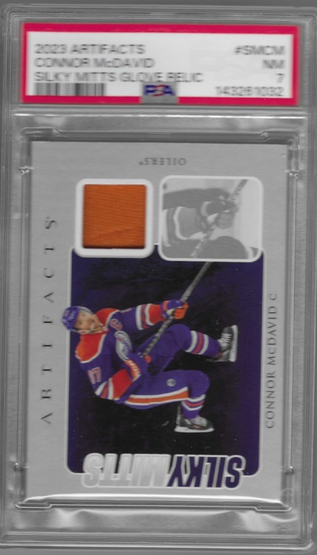 2023-24 Artifacts Silky Mits #SMCM Connor McDavid Patchbl PSA 7 view 1