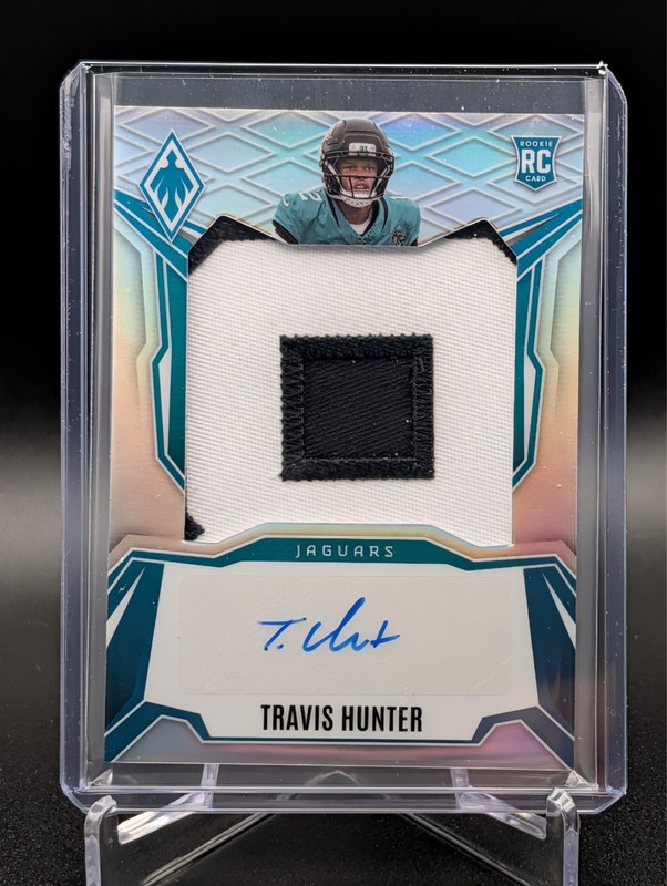 2025 Panini Phoenix Travis Hunter Patch Auto /149 RPS-THR Rookie Silver Jaguars