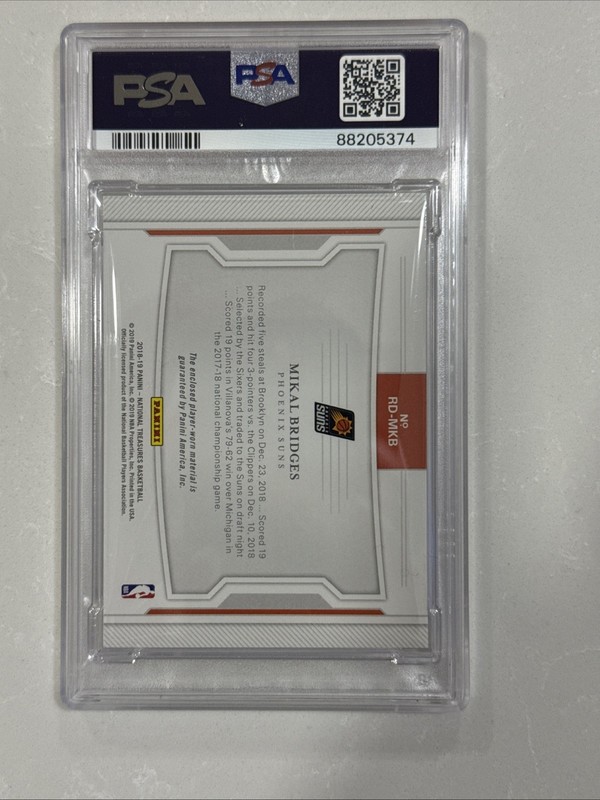 2018 Panini National Treasures /25 Mikal Bridges Rookie Dual Materials PSA 9 view 2