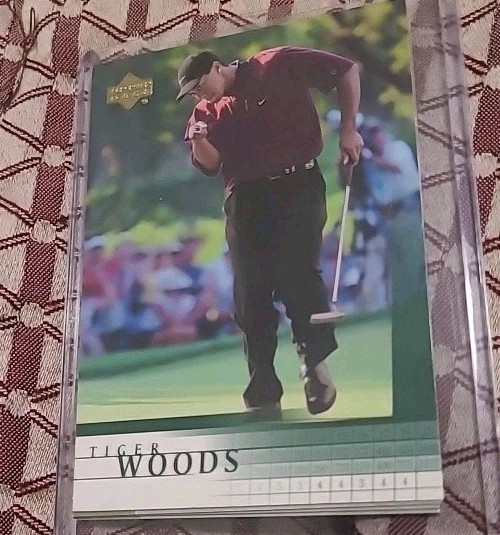 Tiger Woods x (2) 2001 Upper Deck Rookie Card, 1 PSA 8, plus 1 raw, excellent. view 2