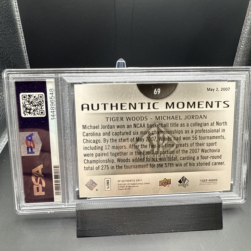 2014 SP Authentic Tiger Woods, Michael Jordan PSA 8 Authentic Moments #69 GOATS view 2