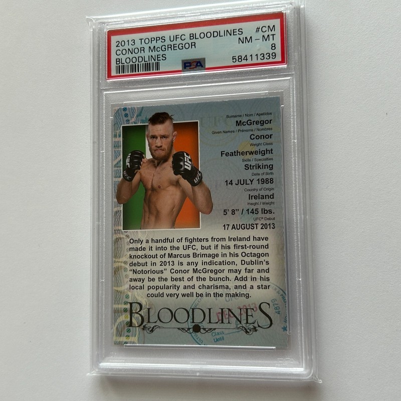 Conor McGregor 2013 Topps UFC Bloodlines Debut Bio Rookie Insert Card #CM PSA 8