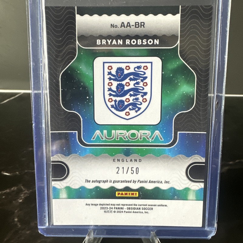 2023-24 Panini Obsidian - Aurora Autographs Bryan Robson #AA-BR /50 (AU) view 2