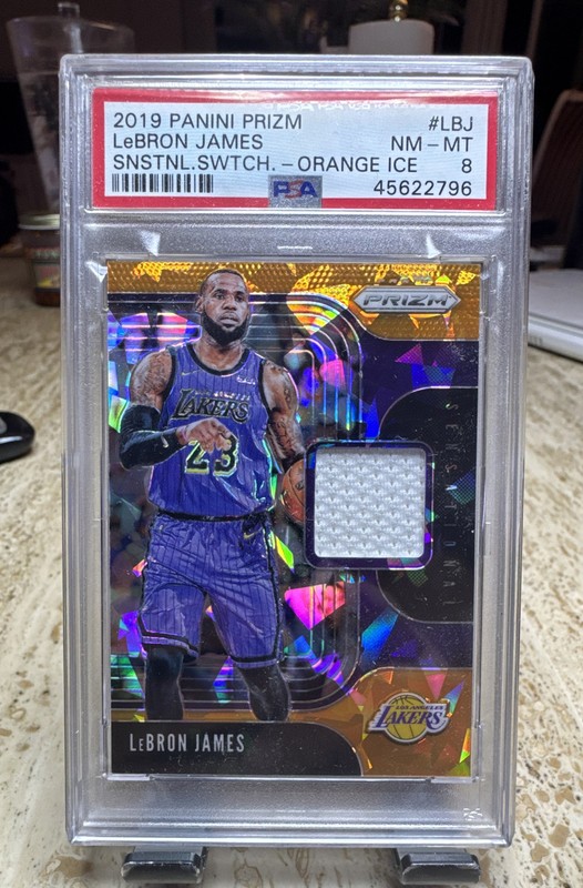 2019-20 Panini Prizm - Orange Ice Swatches Jersey LeBron James PSA 8