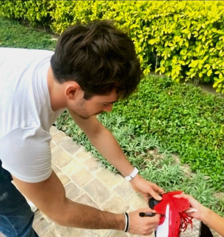 Charles Leclerc signed Ferrari F1 Formula One Puma Trionfo Carbon Fiber - PSA view 2