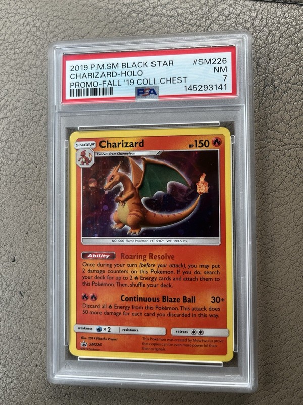 Pokemon 2019 SM Black Star Promo Charizard Holo SM226 English PSA 7