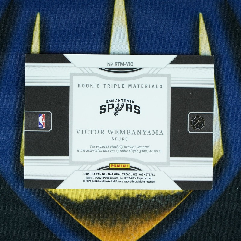 Victor Wembanyama 2023-24 Panini National Treasures Triple Materials Patch Red / view 2