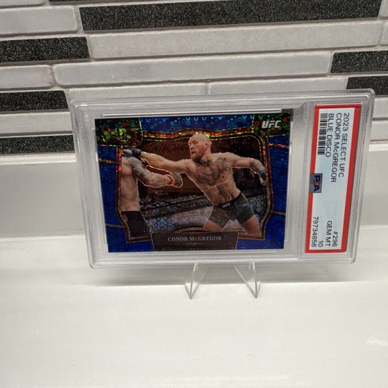 Panini 2023 Select UFC Octagonside Conor McGregor #296 Blue Disco /49 PSA 10