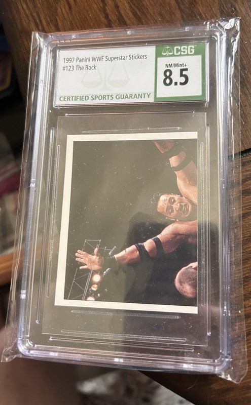 Panini 1997 WWF Superstar Stickers The Rock #123 CSG 8.5 Graded Card