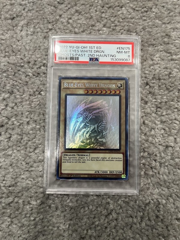 Yu-Gi-Oh Blue-Eyes White Dragon 2022 Ghost Rare 1st Edition PSA 8