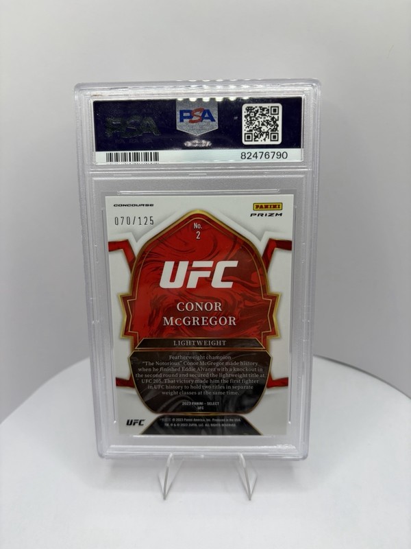 2023 Panini Select UFC - Concourse Conor McGregor #2 White Prizm /125 PSA 10 view 2