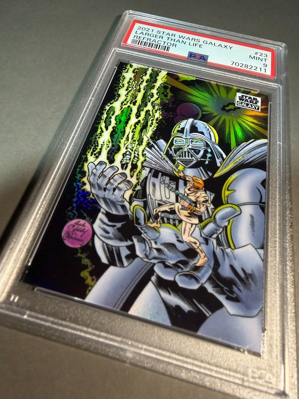 (PSA 9) 2021 Star Wars Galaxy #23, “Larger Than Life” Refractor